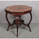 A Victorian quarter veneered octagonal rosewood window table. With strung inlay, marquetry