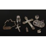 A box of silver oddments including two crosses one mother of pearl, thimble openwork brooch, ingot