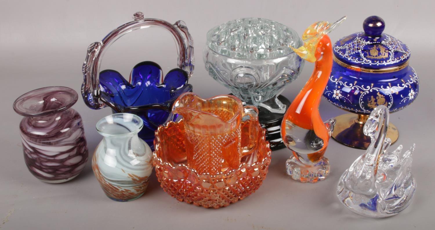 A collection of coloured glasswares to include blue glass basket, Marano cockerel, carnival glass,