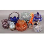 A collection of coloured glasswares to include blue glass basket, Marano cockerel, carnival glass,