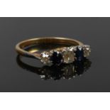 An antique gold diamond and sapphire ring with central cushion cut diamond, Size N 1/2, 2.55g.