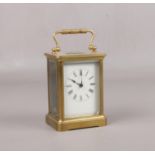 A brass cased carriage clock. With Swiss 8 day movement having platform escapement, 14cm. Running.