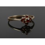 A 9ct gold garnet cluster ring. Size P.