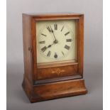 A 19th century walnut cased mantel clock with painted square dial. Housing an 8 day movement by