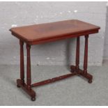 A Victorian mahogany centre table raised on turned supports, 91cm x 50cm, 70cm high.