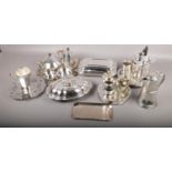 A collection of silverplate to include 4 piece tea service, 3 trays, coffee pots, plate warmer, etc.