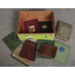 Nine empty vintage postcard albums.