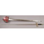 A Scottish basket hilted sword stamped Mole, Birmingham and with broad arrow mark. Along with a