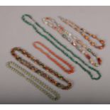 Six strings of hardstone beads to include Malachite, carnelian etc.