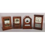Four American alarm clocks including simulated rosewood cases and Seth Thomas examples. For spares