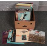 A box of easy listening and classical LP records.