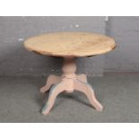 A pine centre pedestal circular kitchen table. With distressed painted base and striped top, 106cm