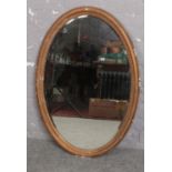 An oval bevel edge mirror ( approx 67 cm x 100 cm)