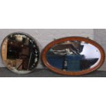 Two wall mirrors to include oak framed bevel edged oval example.