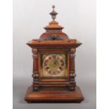 A German 14 day strike HAC mantel clock on walnut case with square brass dial, 44cm high.