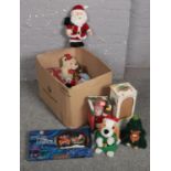 A box of Christmas decorations to include Santa teddy, window lights, animated snowman etc.