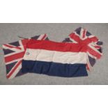 Two vintage Union Jack flags along with a Dutch example.