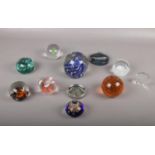 A collection of paperweights, various colours and sizes