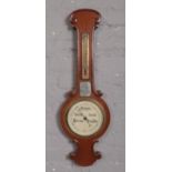 A mahogany banjo barometer, with presentation plaque for Carlisle Works Provident Soctiety, dated