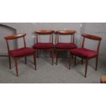 A set of four Greaves & Thomas teak dining chairs.