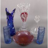 A collection of coloured glassware to include pair of bark vases, large blue glass vase, decanter,