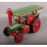 A hand made painted wooden steam engine.