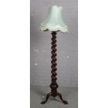 A mahogany barley twist standard lamp.