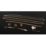 A quantity of 9ct gold jewellery. Including two necklaces, two bracelets, a heart shaped pendant set