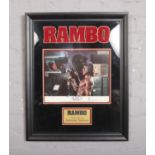 A framed Rambo display, autographed by Sylvester Stallone. (58 x 44cm).