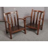 A pair of mahogany nursing chairs.