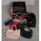 A box of assorted handbags to include Radley etc.