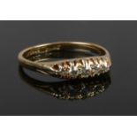 An 18ct gold five stone diamond ring, size P 1/2.