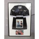 A large framed Mike Tyson display with autographed boxing robe. (163cm x 107cm).