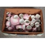 A box of Victorian souvenir tea wares