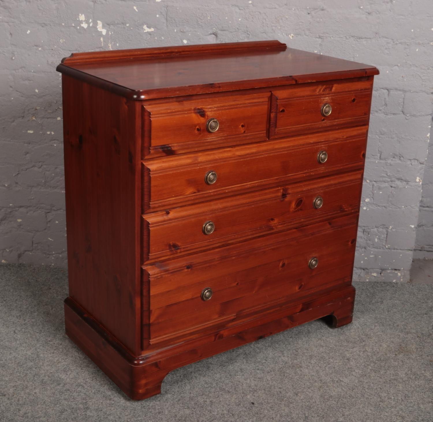 A modern pine Ducal two over three chest of drawers.