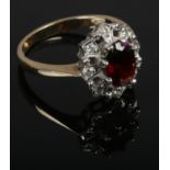 A 9ct gold diamond and garnet ring, size O.