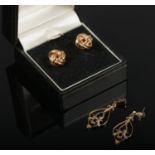 A pair of 9ct gold earrings, along with a pair of gilt metal drop earrings.