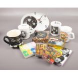 A box of The Beatles collectables, to include mugs, magnets, clocks etc.