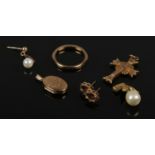 A quantity of 9ct gold jewellery oddments to include cross pendant, ring, earrings etc. 7.33g