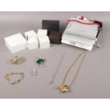 A collection of costume jewellery, necklace, bracelet, quartz wristwatch, brooch to include empty