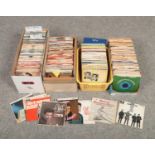 Four boxes of single records and EPs, to include Elvis, The Beatles, The Shadows etc.