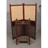 A Victorian mahogany folding dressing screen along with an oak stick stand.