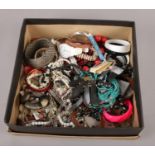 A box of costume jewellery, bangles, beads, quartz wristwatches etc