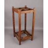 An Arts & Crafts oak stick stand, 61cm high.