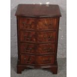 A mahogany serpentine chest of 4 drawers. (77cm x 48cm).
