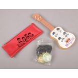 A group of The Beatles collectables, to include pencil case, 12 holographic medals/ pendants and a
