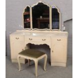 A French painted triple mirror dressing table and stool.