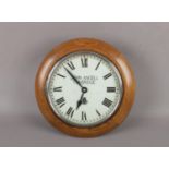 An oak cased Garrard single train wall clock. With painted dial signed John Angell, Tonbridge,