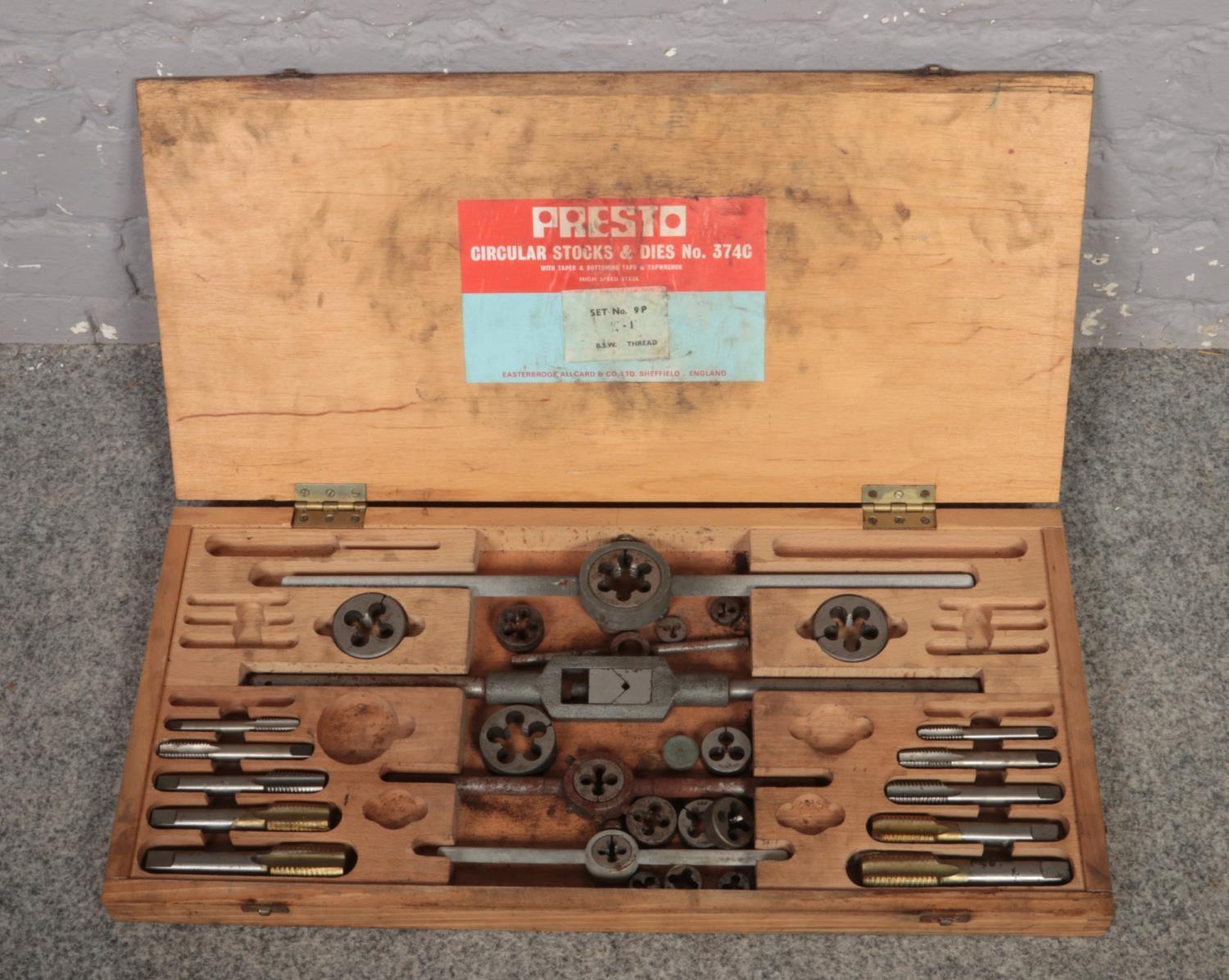 A wooden cased Presto circular stocks and dies part set.