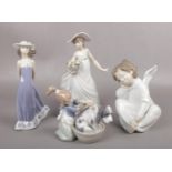 Four Lladro figures to include girl bathing dog, girl with flowers etc.